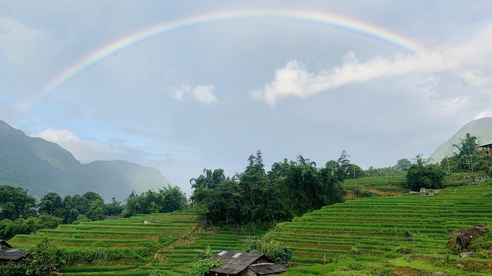 A rainbow over Sung's family rice terraces in Sapa